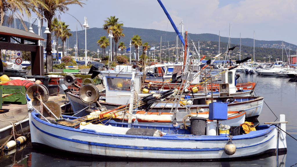 Cavalaire-sur-Mer port with blue fishing boat