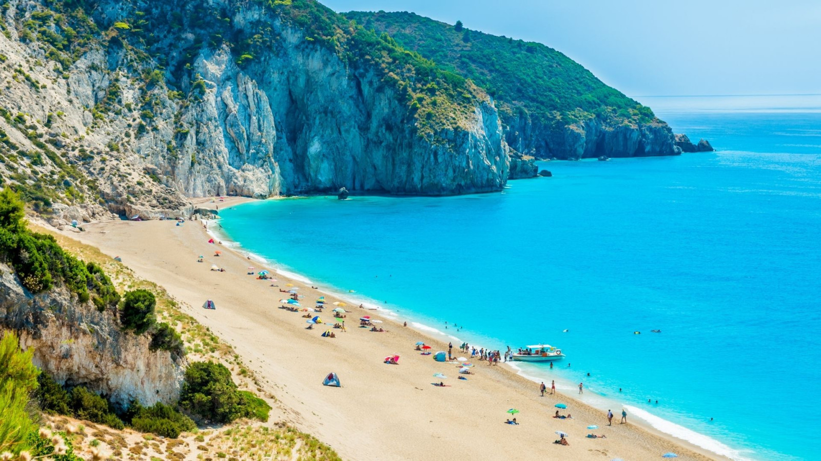 Beach surrounded by rocky mountains