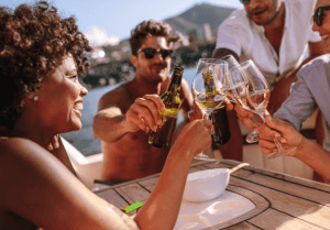 Friends laughing while enjoying their sailing holiday